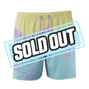 Pastel yellow and blue board shorts with pink and purple paint drip design and anime character graphic on leg