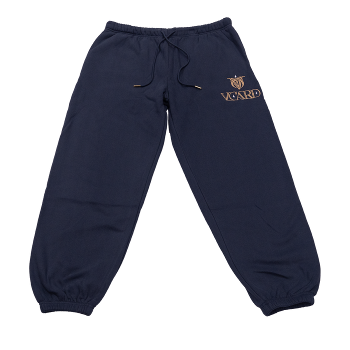 Navy sweatpants with gold embroidered VCard logo and gold-tipped drawstring on soft fabric.